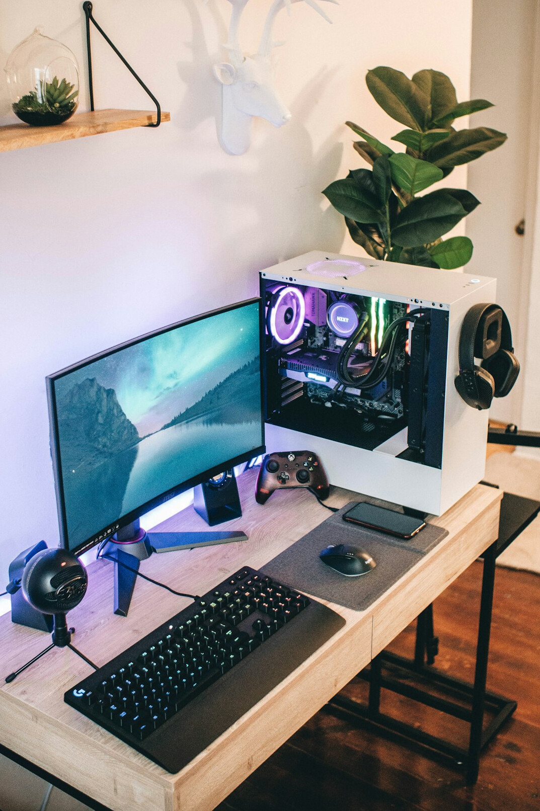 Desk setup with dual computer monitors showing code and diagrams
